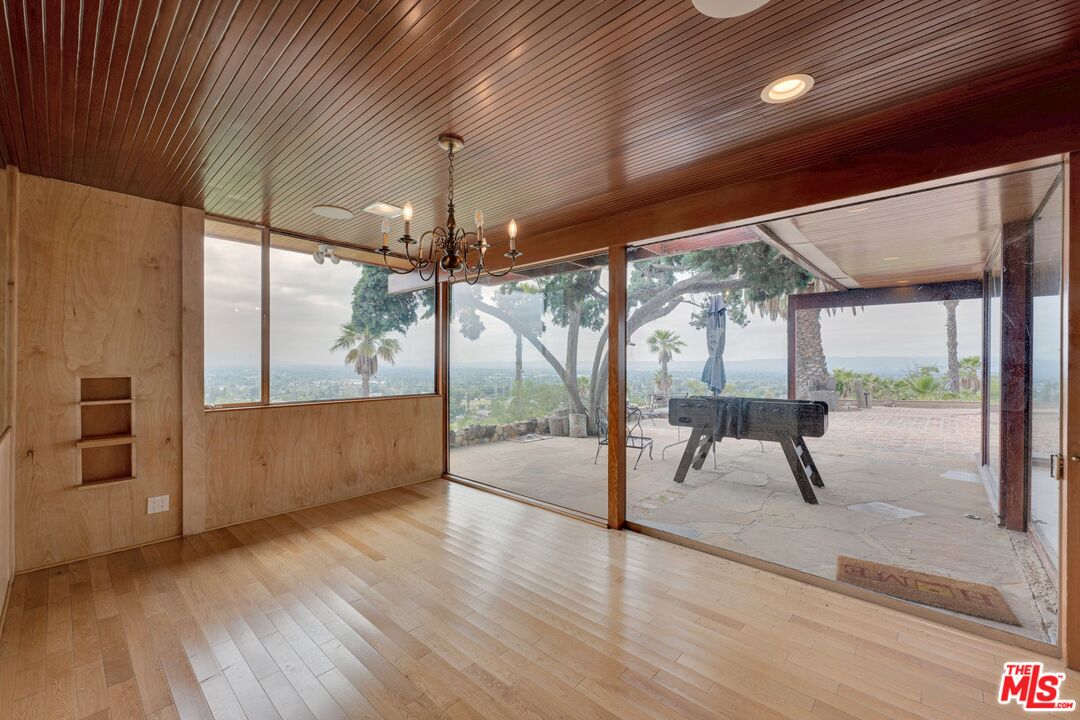 17728 Ridgeway Road Granada Hills, CA 91344 - Photo 11 of 54 a view of an empty room with glass door