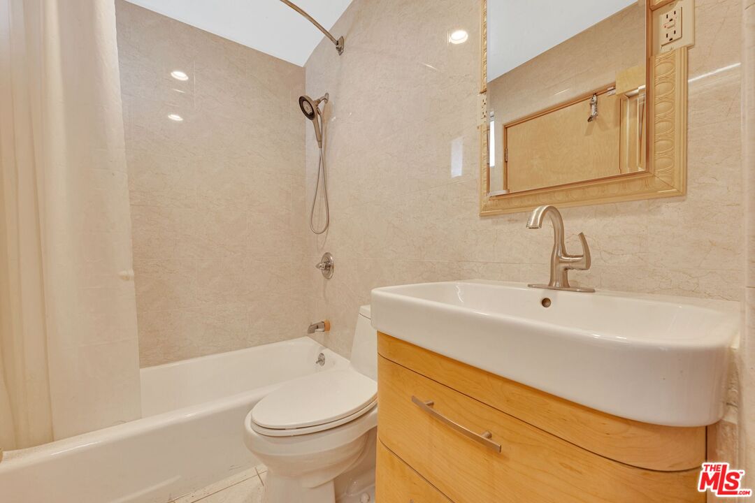 17728 Ridgeway Road Granada Hills, CA 91344 - Photo 27 of 54 a bathroom with a sink a toilet and shower