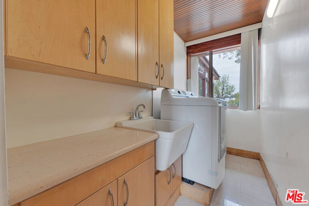 17728 Ridgeway Road Granada Hills, CA 91344 - Photo 32 of 54 a room with a sink cabinets and a window