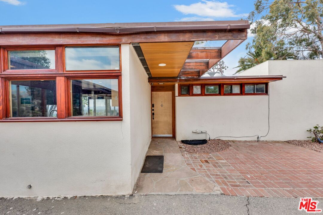 17728 Ridgeway Road Granada Hills, CA 91344 - Photo 33 of 54 a view of a house with a wooden fence