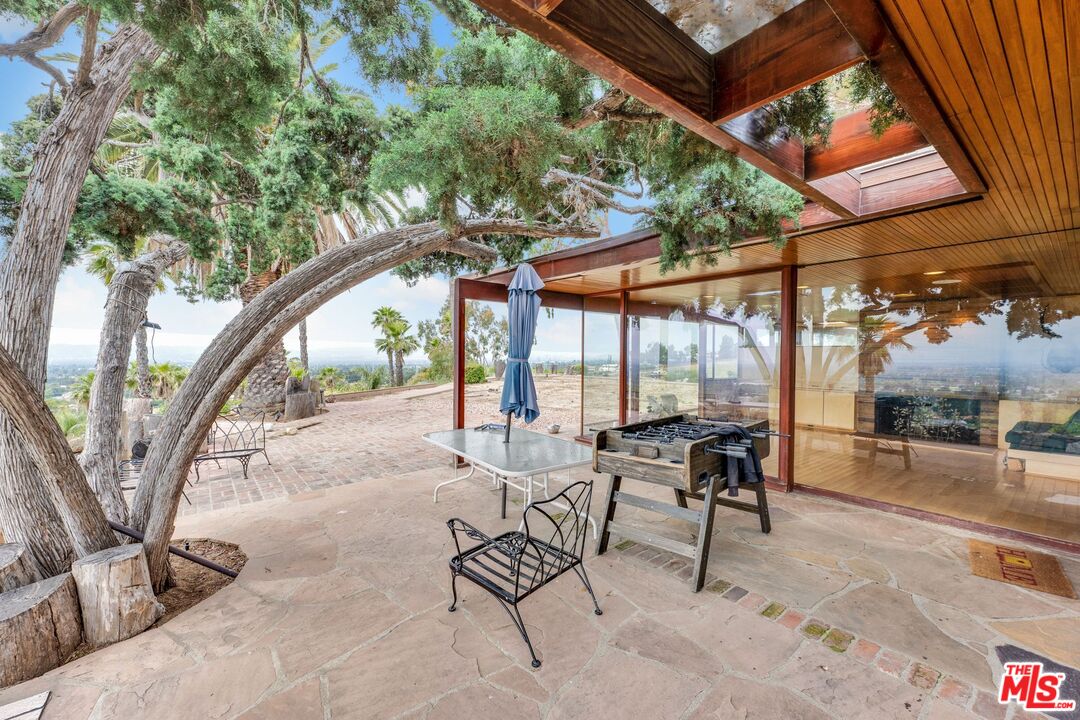 17728 Ridgeway Road Granada Hills, CA 91344 - Photo 36 of 54 a building outdoor space with patio furniture and potted plants