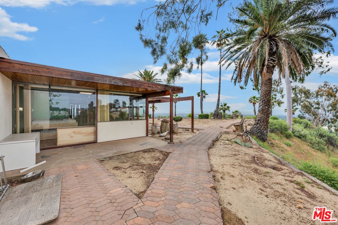 17728 Ridgeway Road Granada Hills, CA 91344 - Photo 38 of 54 a view of a backyard with a patio and swimming pool