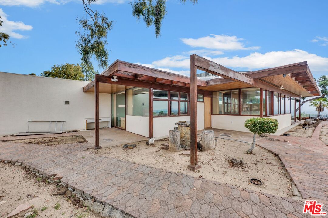 17728 Ridgeway Road Granada Hills, CA 91344 - Photo 39 of 54 a house view with a backyard space