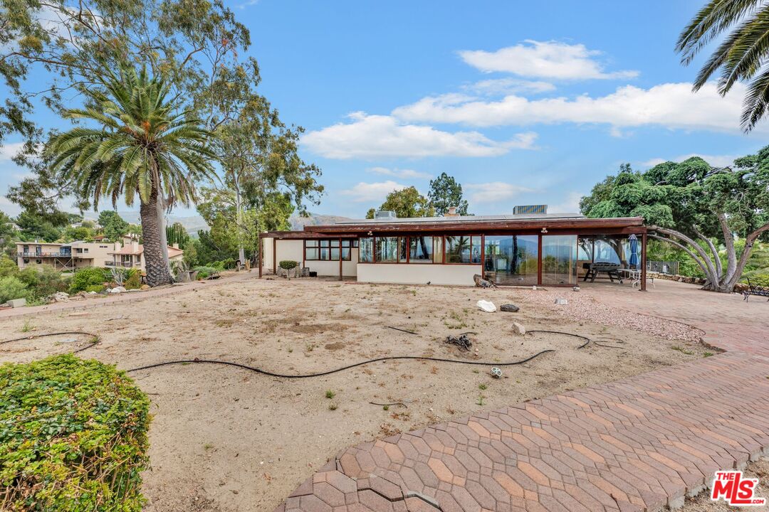 17728 Ridgeway Road Granada Hills, CA 91344 - Photo 43 of 54 a view of a house with a yard