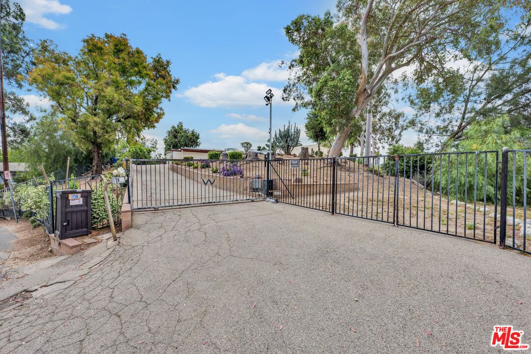 17728 Ridgeway Road Granada Hills, CA 91344 - Photo 49 of 54 a view of a backyard with large trees