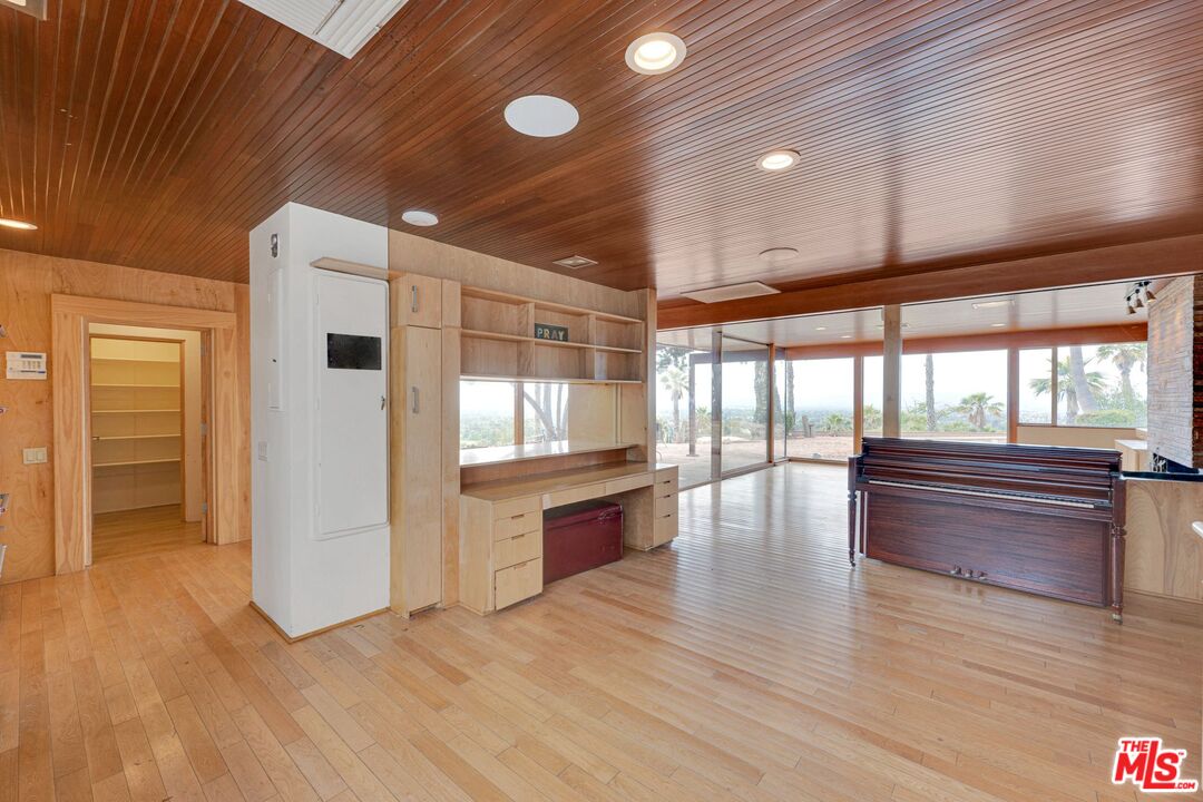 17728 Ridgeway Road Granada Hills, CA 91344 - Photo 7 of 54 a kitchen with stainless steel appliances granite countertop a refrigerator and a stove