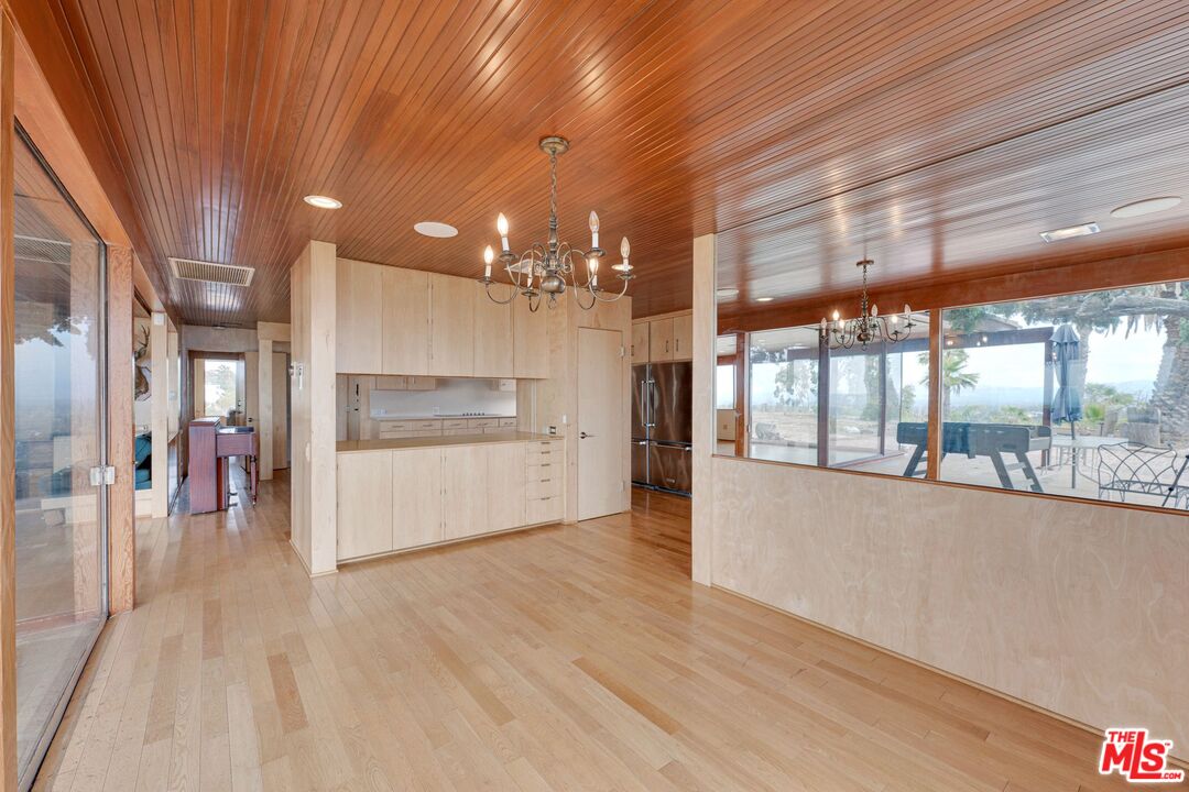 17728 Ridgeway Road Granada Hills, CA 91344 - Photo 10 of 54 a open kitchen with a sink and refrigerator