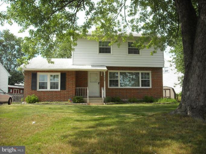 4430 Kendi Road Nottingham, MD 21236 - Photo 1 of 13 a front view of house with yard and green space