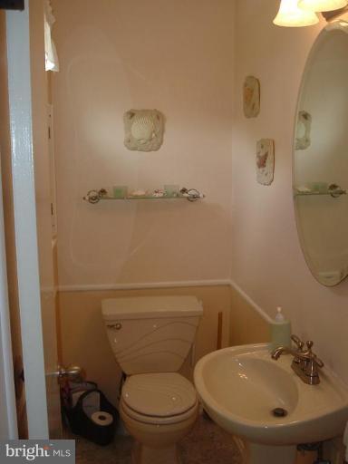 4430 Kendi Road Nottingham, MD 21236 - Photo 11 of 13 a bathroom with a toilet sink and mirror