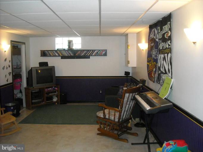 4430 Kendi Road Nottingham, MD 21236 - Photo 12 of 13 a room with furniture and a flat screen tv