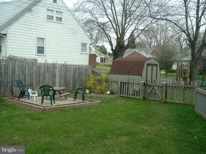 4430 Kendi Road Nottingham, MD 21236 - Photo 9 of 13 a view of a chair and table in backyard of the house
