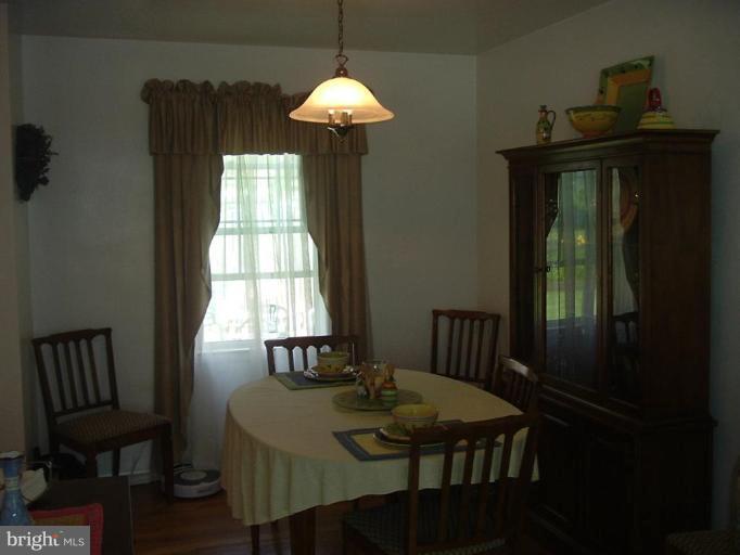 4430 Kendi Road Nottingham, MD 21236 - Photo 10 of 13 a view of a dining room with furniture window and outside view