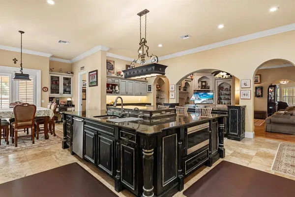 a kitchen with stainless steel appliances granite countertop a stove and a sink