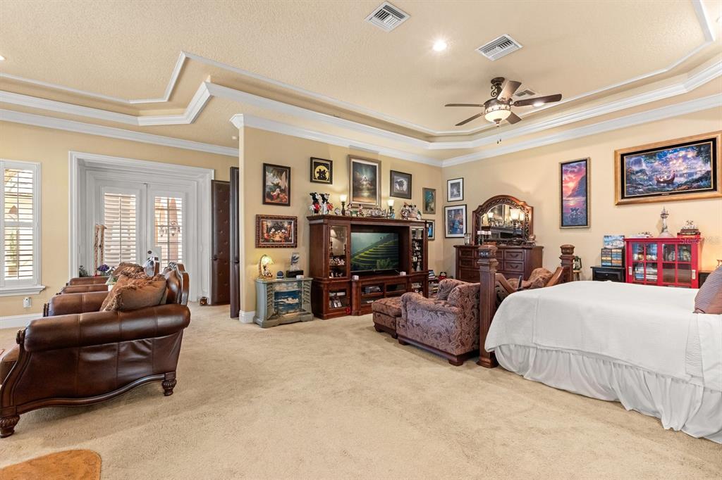 9400 Laws Road Clermont, FL 34714 - Photo 21 of 58 a living room with furniture and a flat screen tv