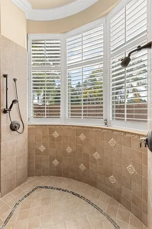 a bathroom with a toilet and a shower curtain