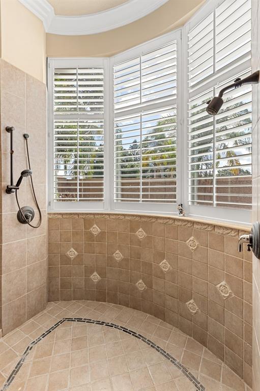 9400 Laws Road Clermont, FL 34714 - Photo 25 of 58 a bathroom with a window and a shower