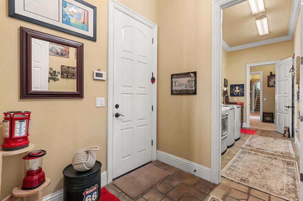 9400 Laws Road Clermont, FL 34714 - Photo 29 of 58 a bathroom with a toilet and a shower curtain