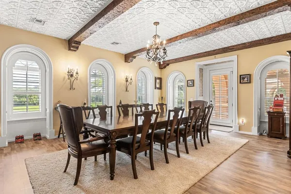 a living room with furniture a rug and white walls