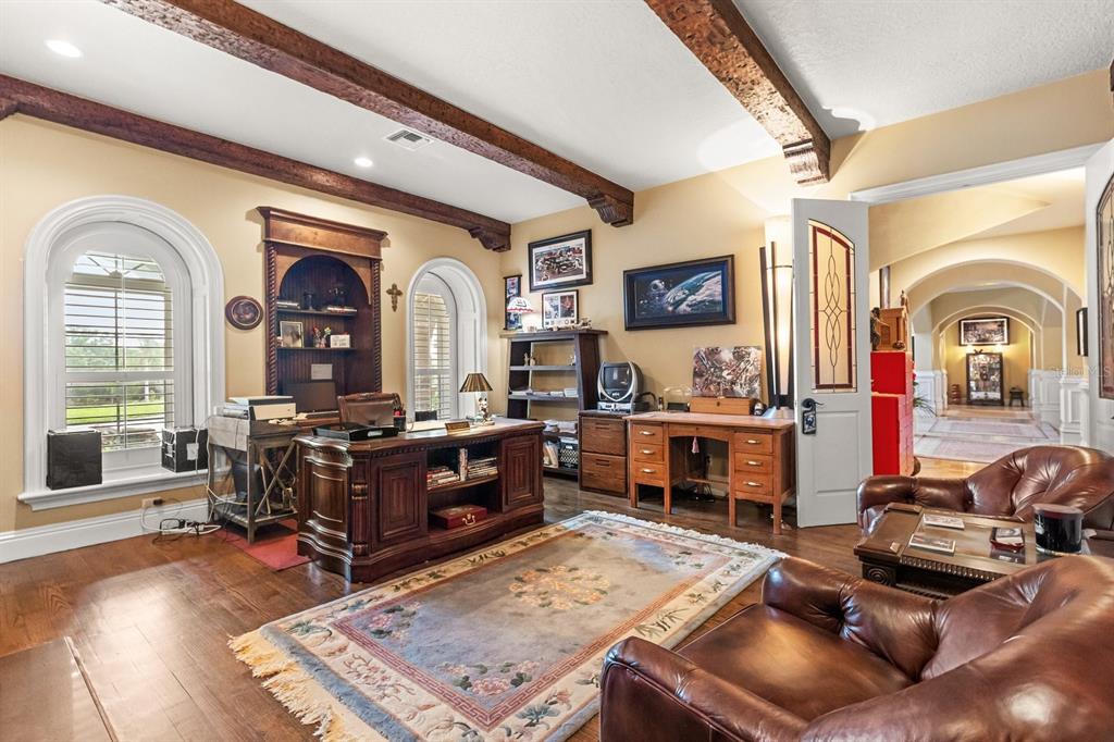 9400 Laws Road Clermont, FL 34714 - Photo 35 of 58 a living room with furniture fireplace and wooden floor