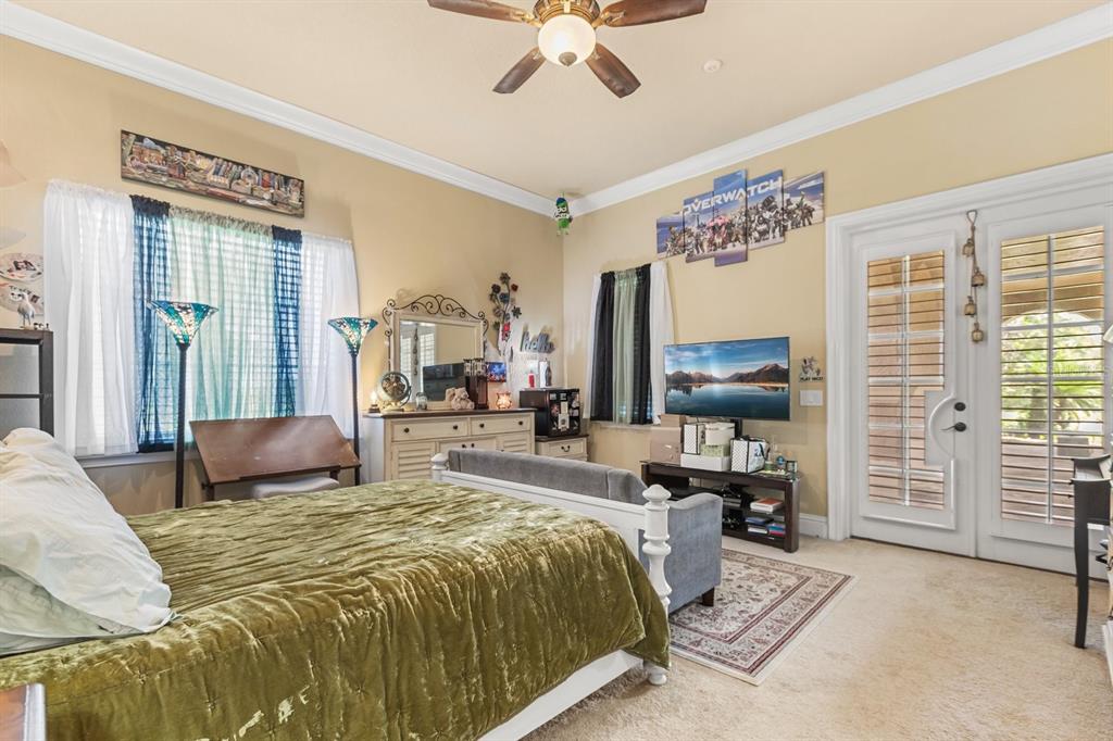 9400 Laws Road Clermont, FL 34714 - Photo 39 of 58 a bedroom with a bed couch and a window