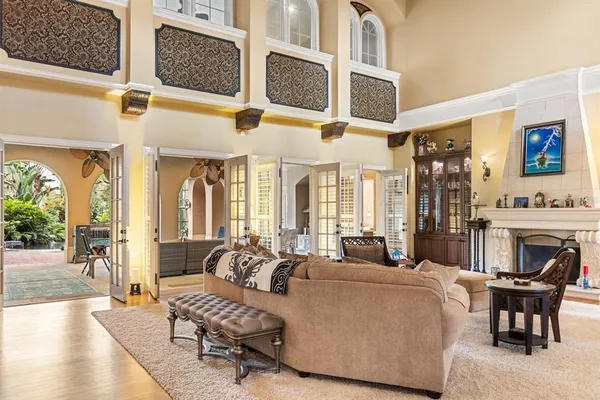a living room with fireplace furniture and a flat screen tv
