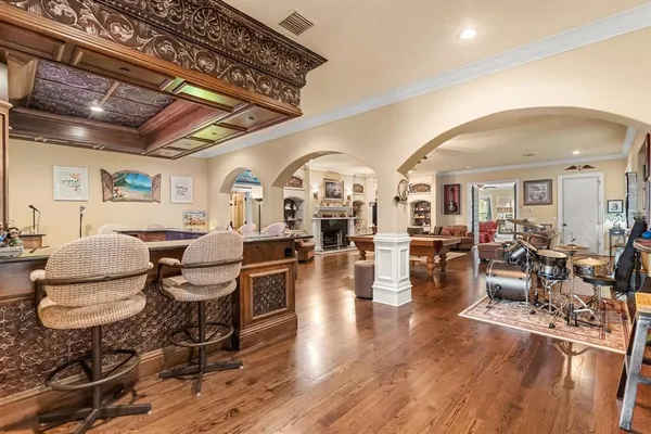 a living room with fireplace furniture and a large window
