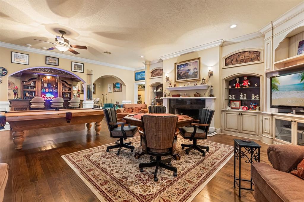 9400 Laws Road Clermont, FL 34714 - Photo 52 of 58 a living room with fireplace furniture and a flat screen tv