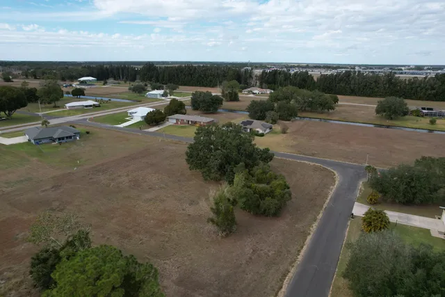 an aerial view of a yard with horses