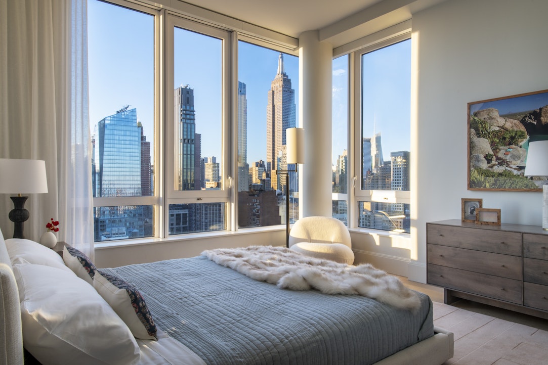 368 3rd Avenue, Unit 32A Manhattan, NY 10016 - Photo 6 of 20 a bedroom with a large bed and a balcony view