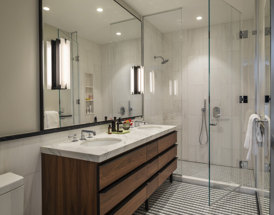 368 3rd Avenue, Unit 32A Manhattan, NY 10016 - Photo 7 of 20 a bathroom with a sink a toilet and shower