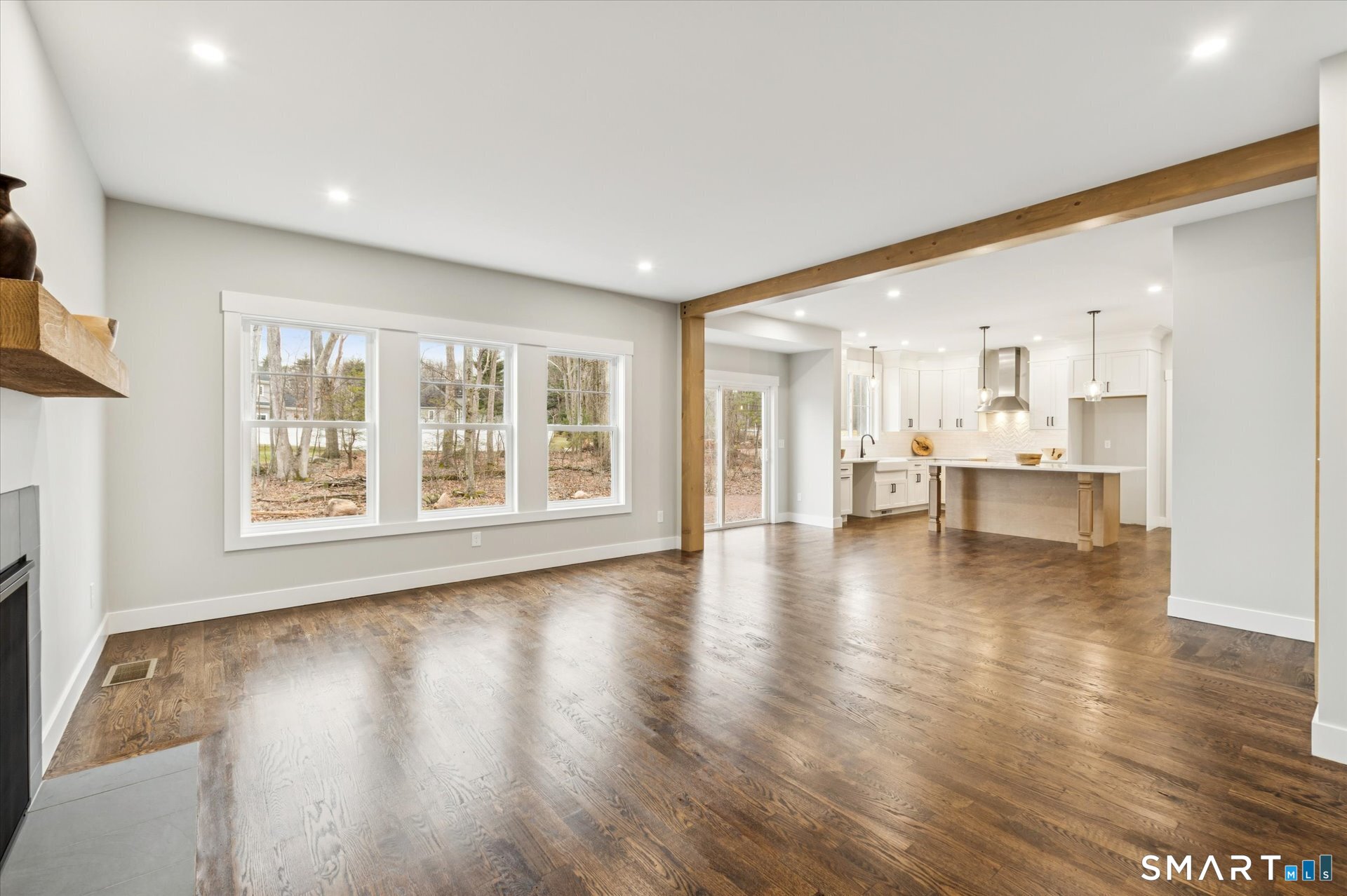 592 Village Street Bristol, CT 06010 - Photo 15 of 38 a view of an empty room with wooden floor and a window