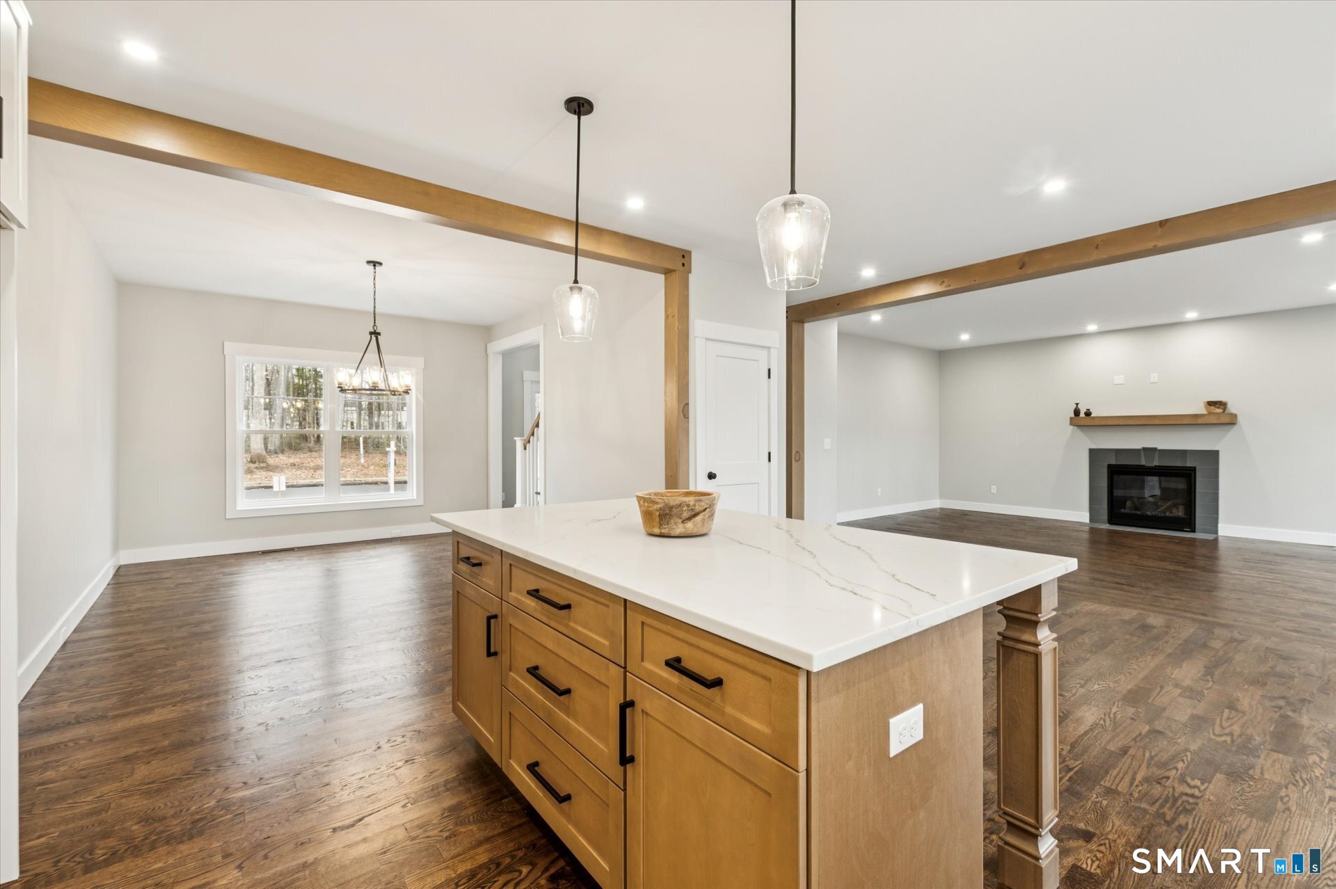 592 Village Street Bristol, CT 06010 - Photo 16 of 38 a kitchen with a sink a chandelier and wooden floor