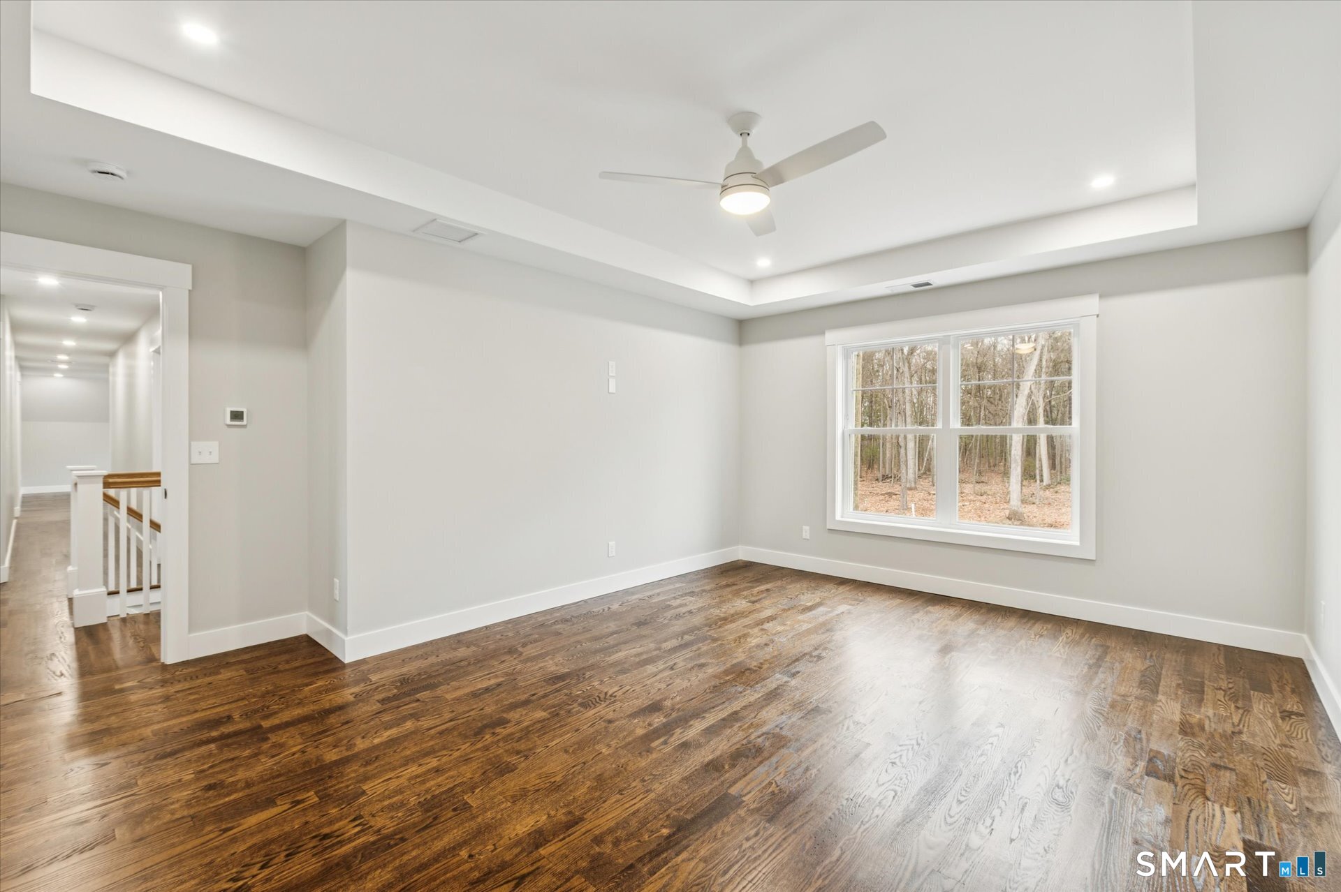 592 Village Street Bristol, CT 06010 - Photo 34 of 38 a view of an empty room with wooden floor and a window
