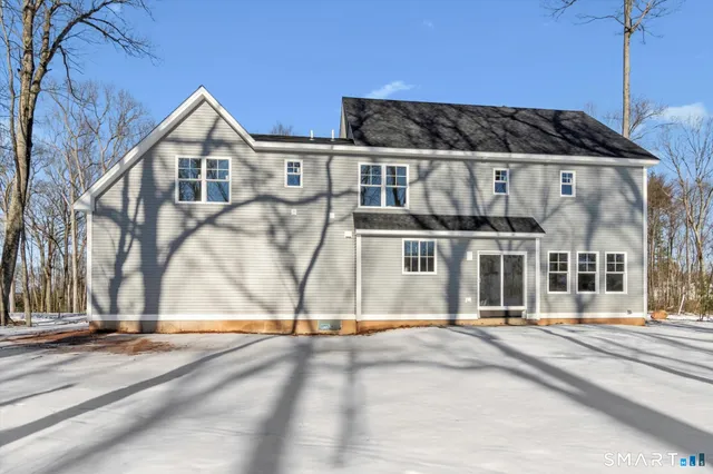 a view of a kitchen and dining room with wooden floor