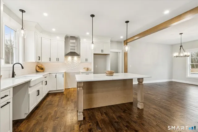 a kitchen with a sink window and cabinets
