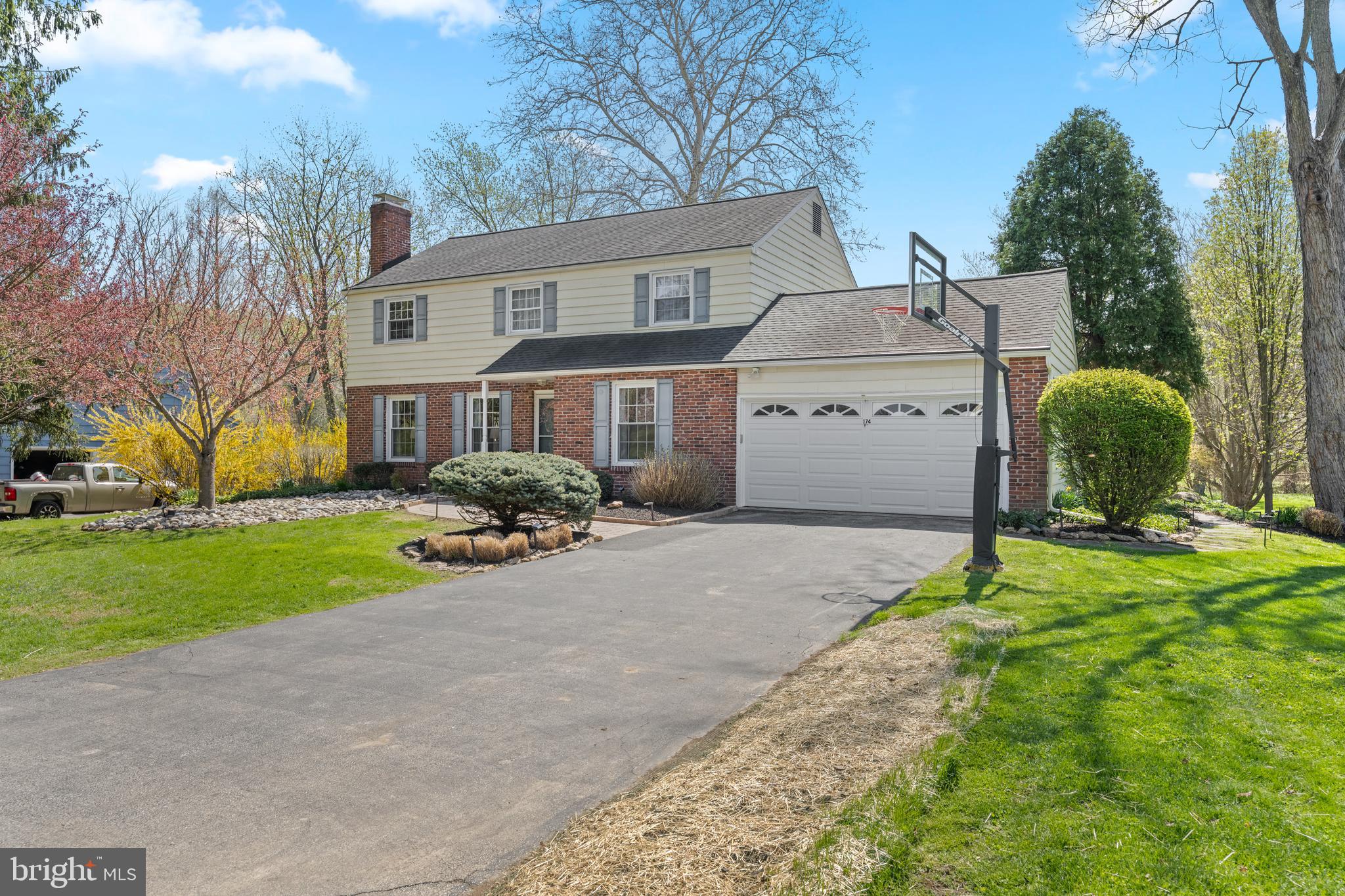 174 Coldstream Drive Berwyn, PA 19312 - Photo 2 of 40 a front view of a house with a yard and garage