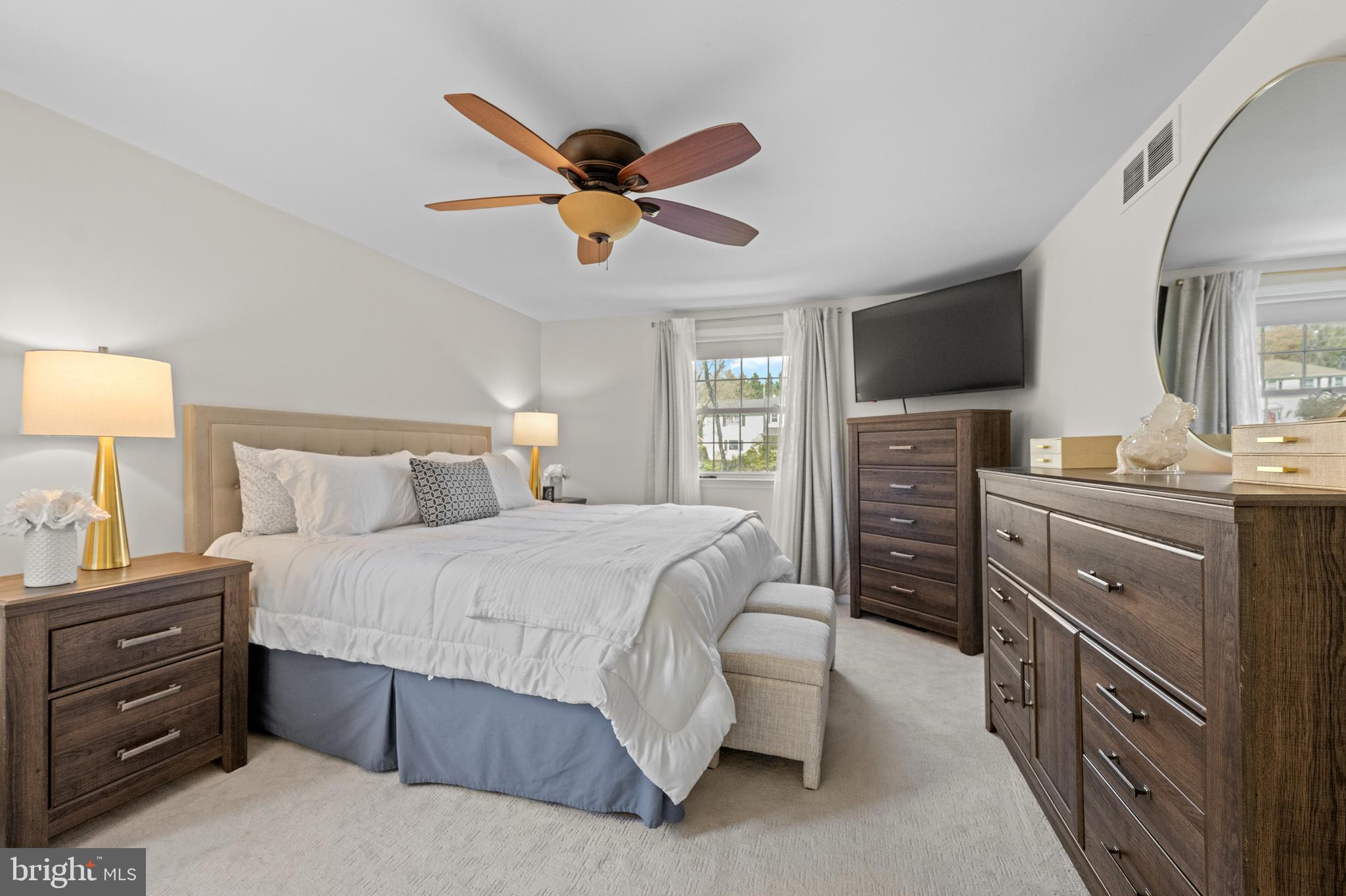 174 Coldstream Drive Berwyn, PA 19312 - Photo 22 of 40 a bedroom with a bed and a chandelier