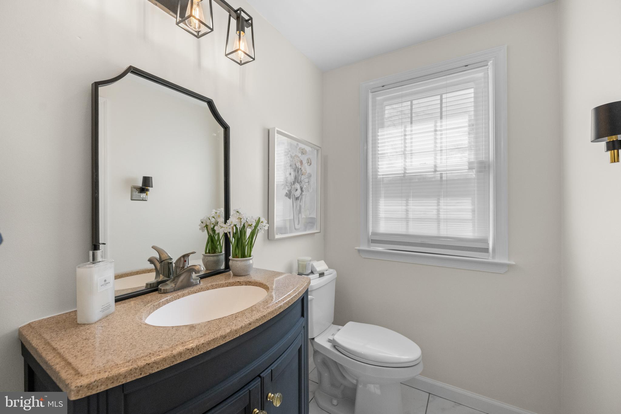 174 Coldstream Drive Berwyn, PA 19312 - Photo 24 of 40 a bathroom with a granite countertop sink and a toilet