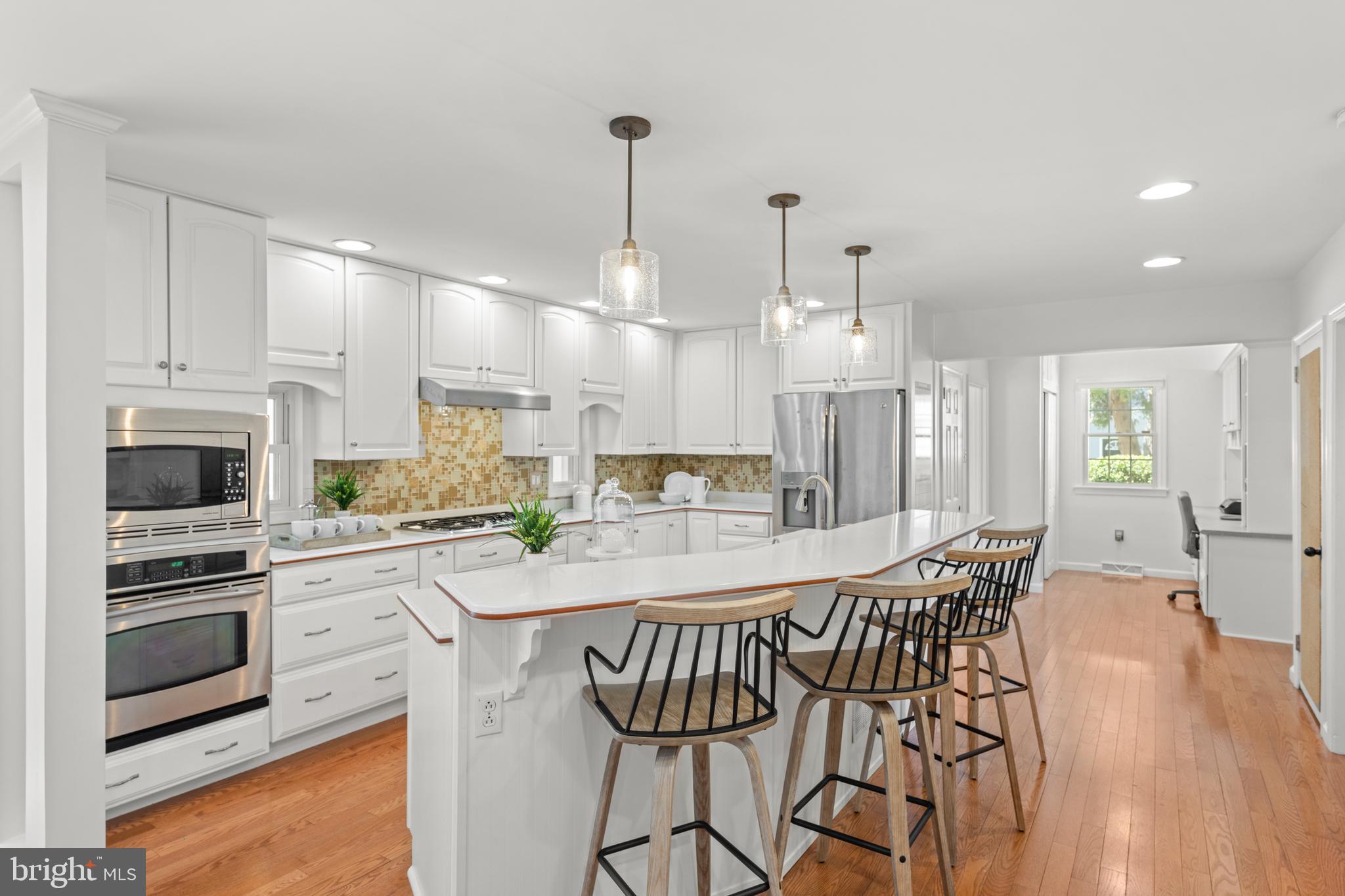 174 Coldstream Drive Berwyn, PA 19312 - Photo 6 of 40 a large kitchen with kitchen island a large island in the center