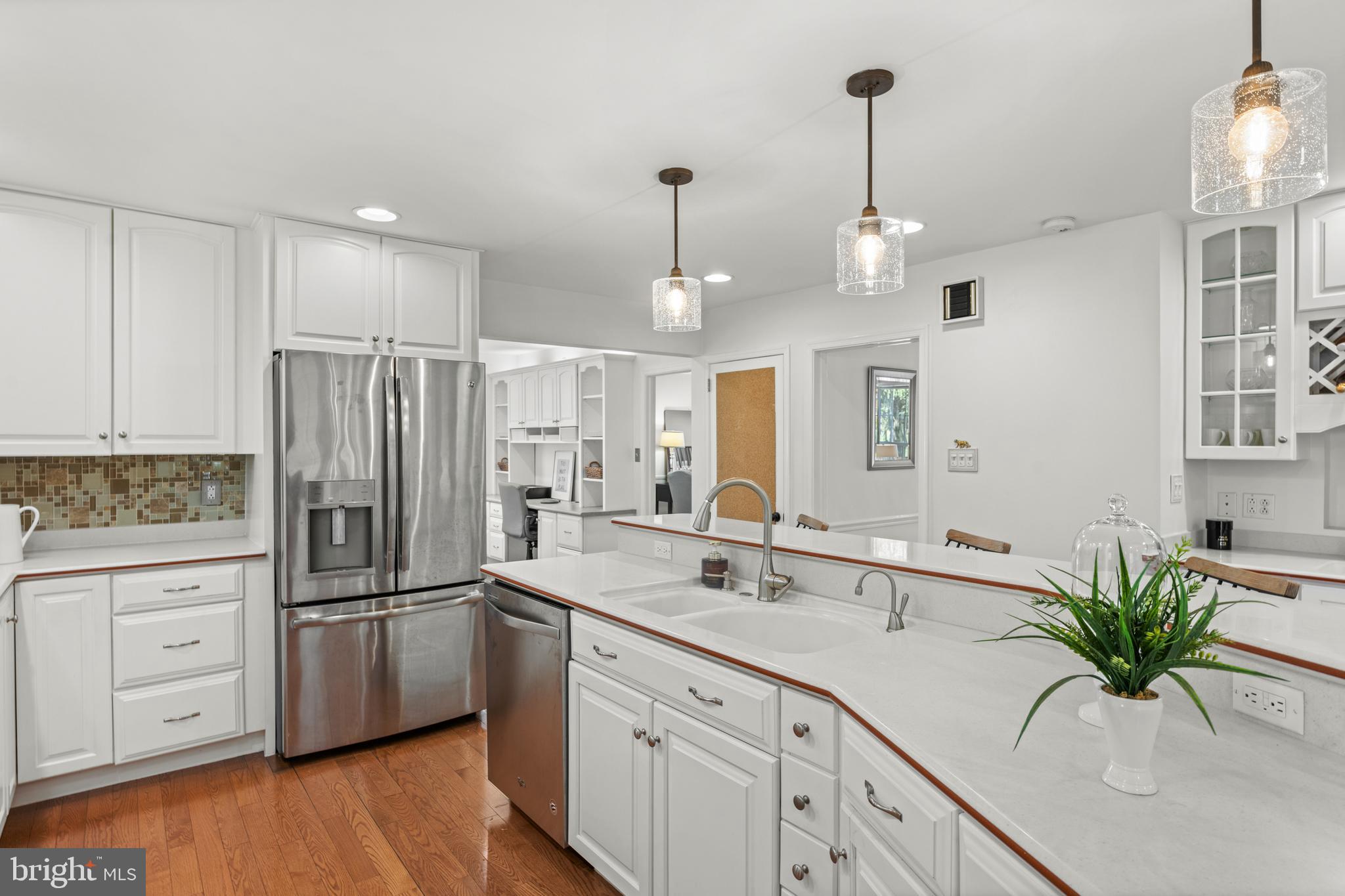 174 Coldstream Drive Berwyn, PA 19312 - Photo 8 of 40 a kitchen with white cabinets and stainless steel appliances