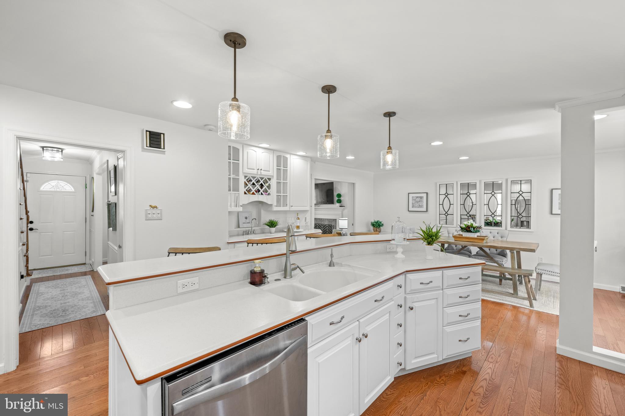 174 Coldstream Drive Berwyn, PA 19312 - Photo 9 of 40 a large kitchen with kitchen island white cabinets and stainless steel appliances