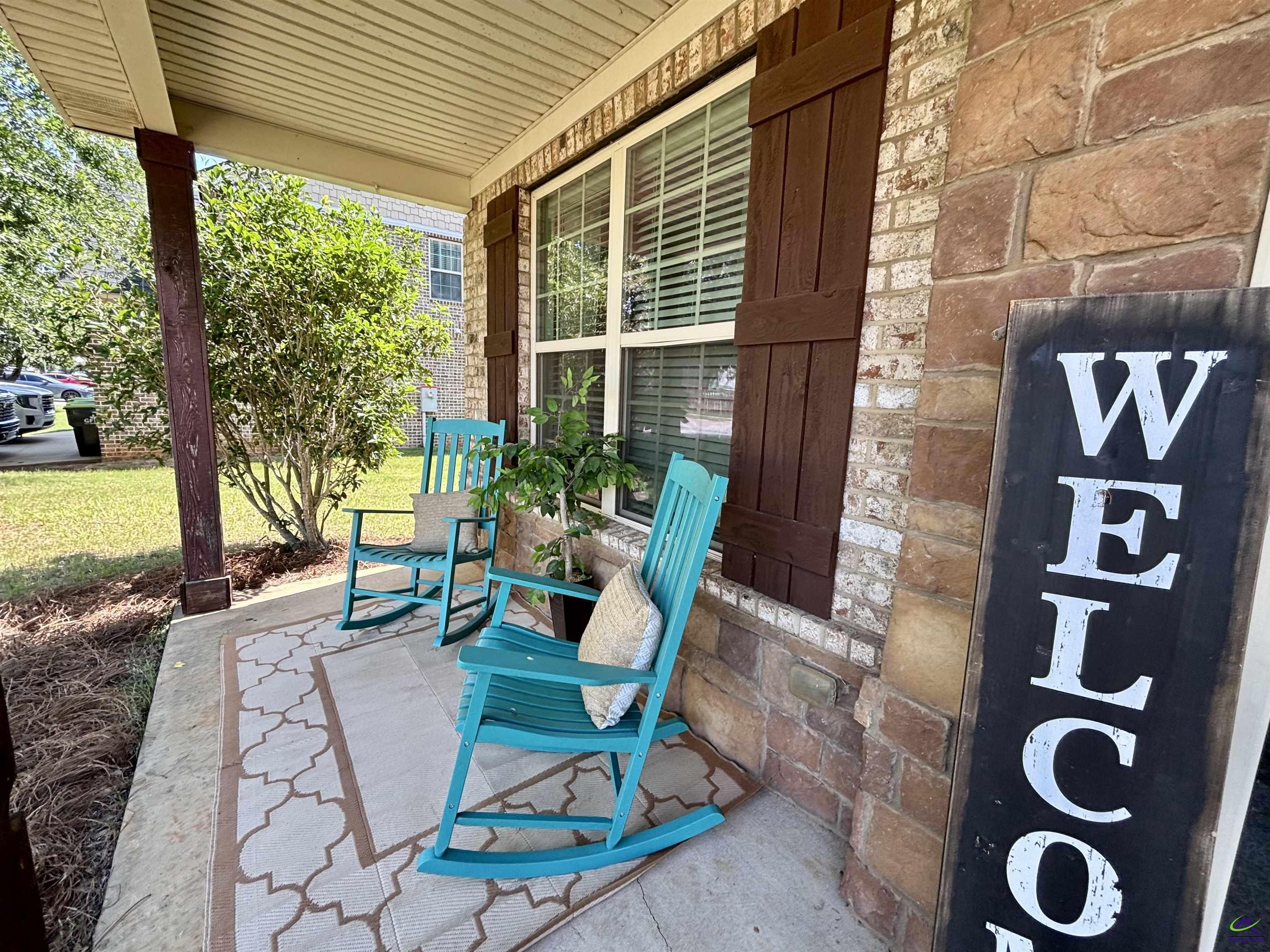 600 Post Oak Way Warner Robins, GA 31088 - Photo 6 of 50 a view of a patio with table and chairs and potted plants