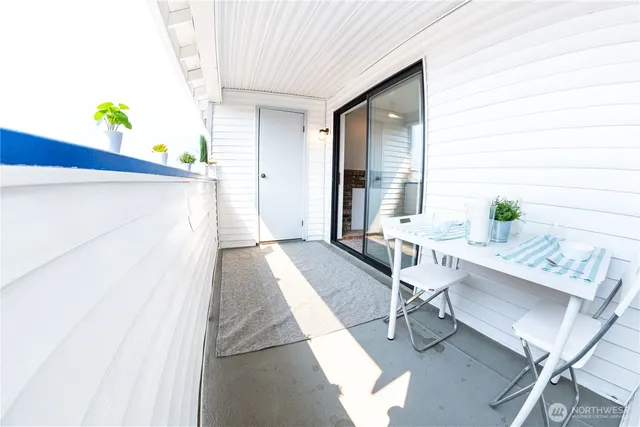 a workspace room with furniture and window