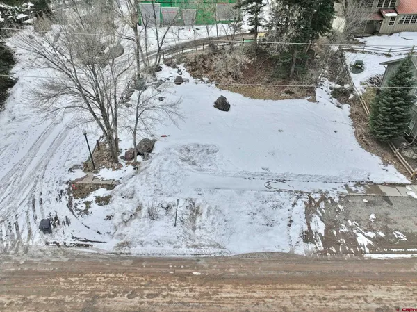 a view of a backyard of the house