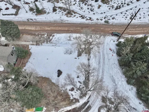 a view of a yard and front of a house