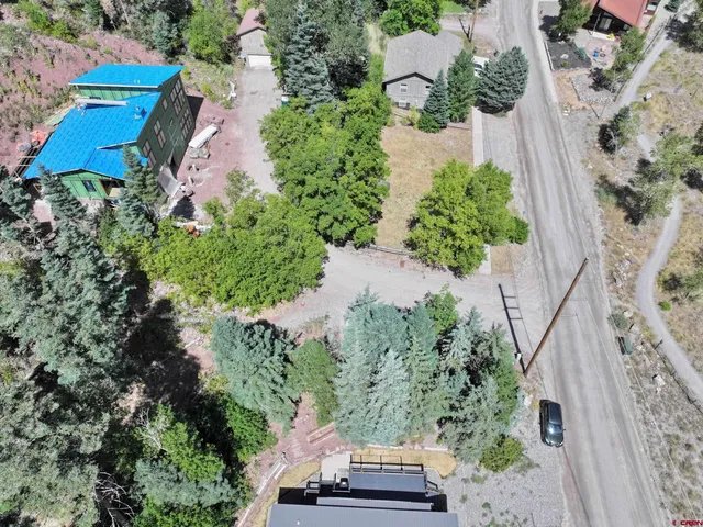 a view of a wooden house with a yard