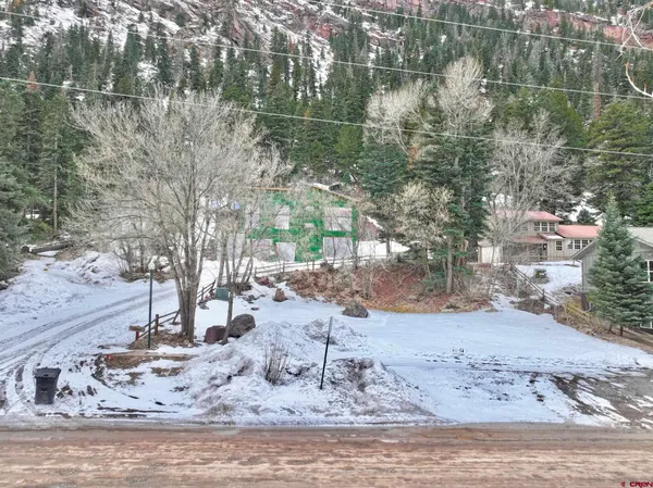 a view of a dry yard covered with snow