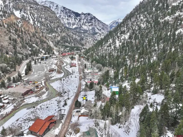 an aerial view of waterside residential houses with outdoor space