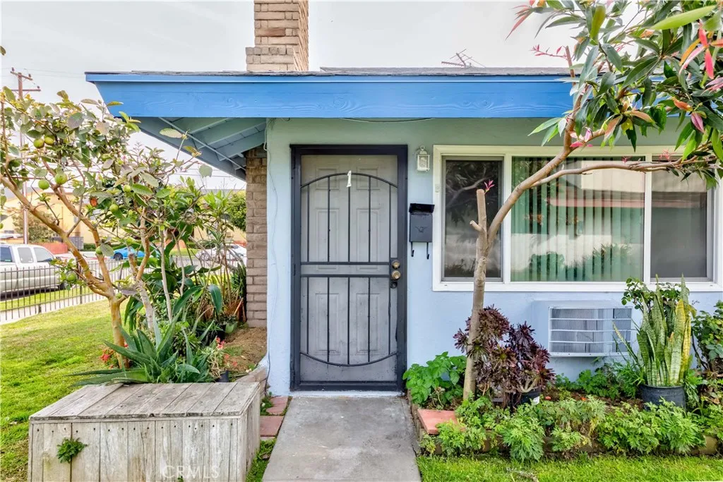 12292 Ranchero Avenue Garden Grove, CA 92843 - Photo 4 of 28 a front view of a house with garden