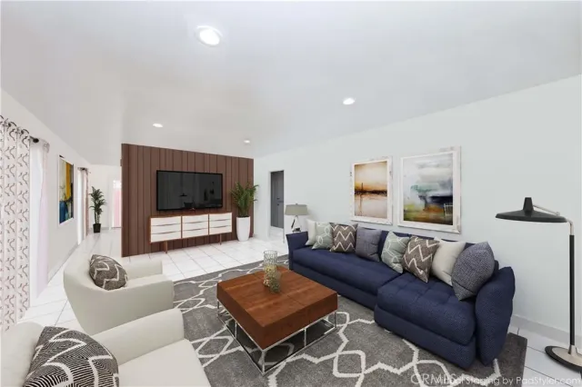a living room with furniture and a flat screen tv